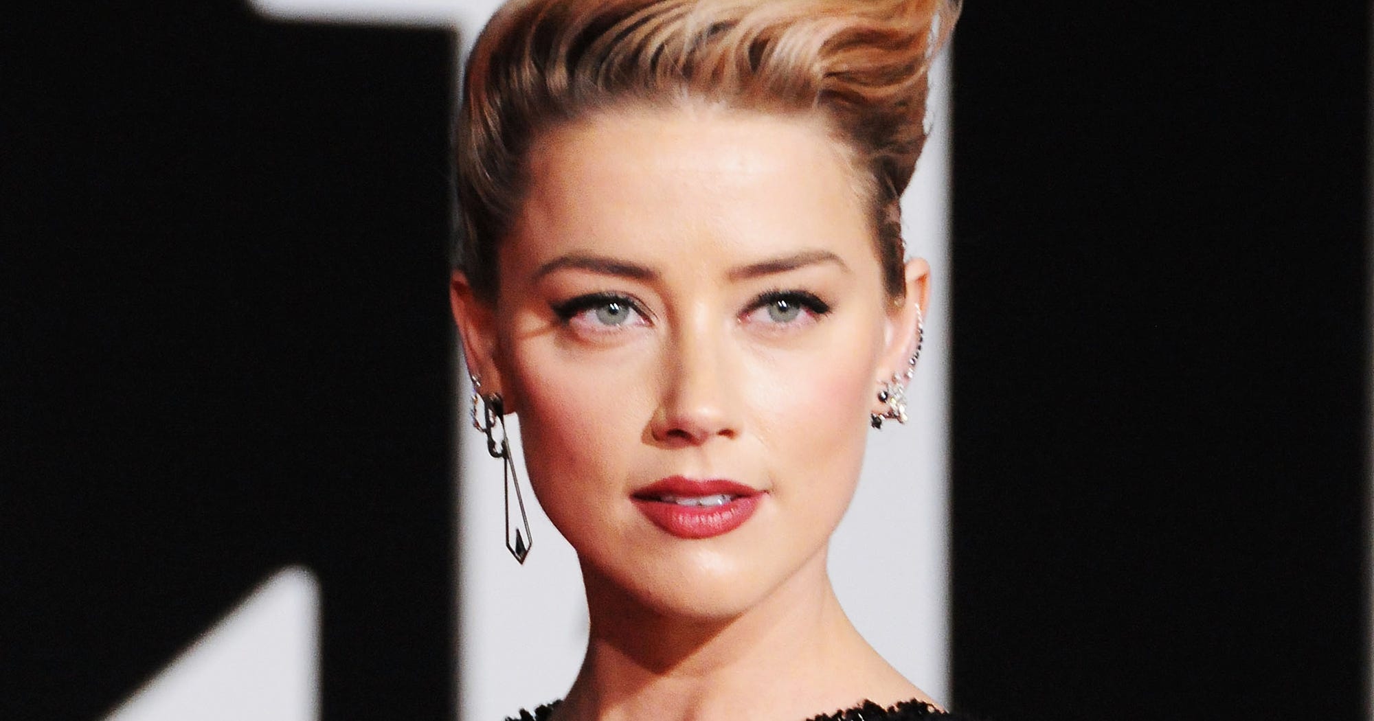 Amber Heard Says She Never Came Out Because She Was "Never In"