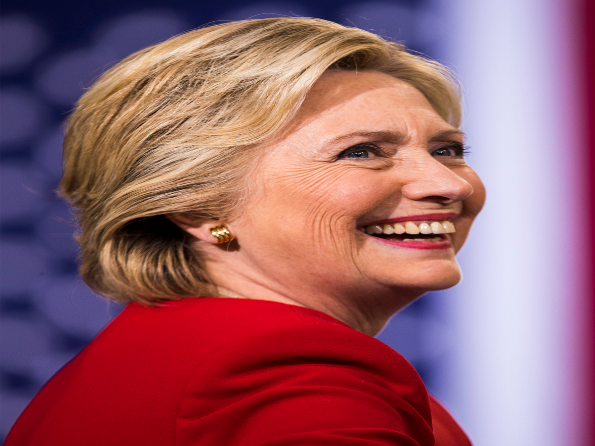 Why This Picture Of Hillary Clinton Reading On A Plane Is Going Viral