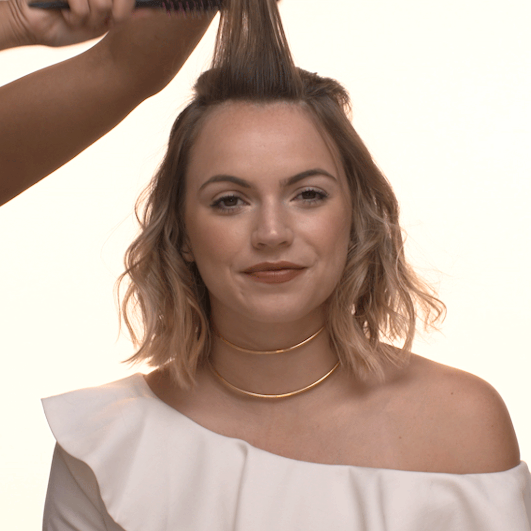 Shake out the curls or waves to loosen them and make them look more lived-in.