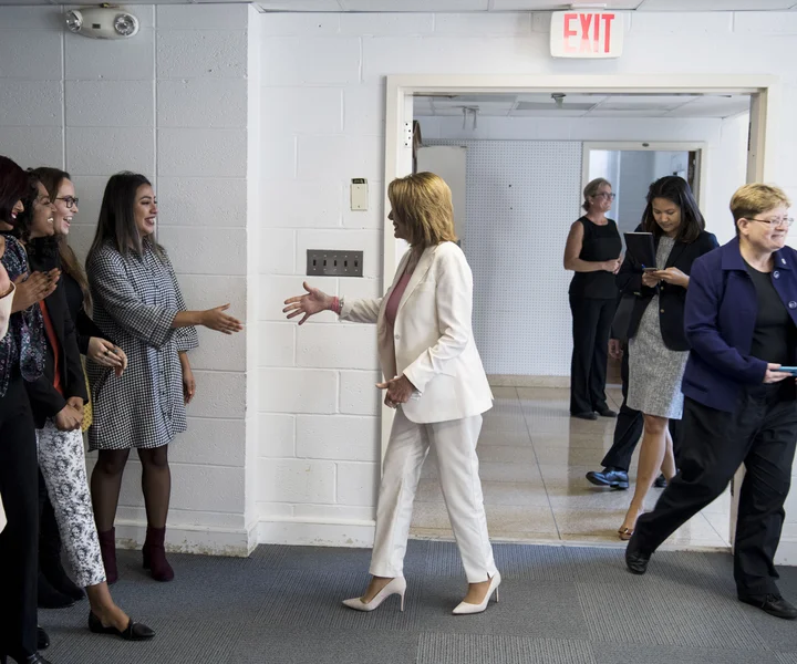 nancy pelosi wearing a short dress heels and hose Nancy Pelosi's Political Style Statements Through the Years [PHOTOS]